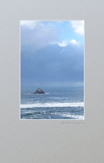 Castle Rock from Arch Cape beach in stormy weather